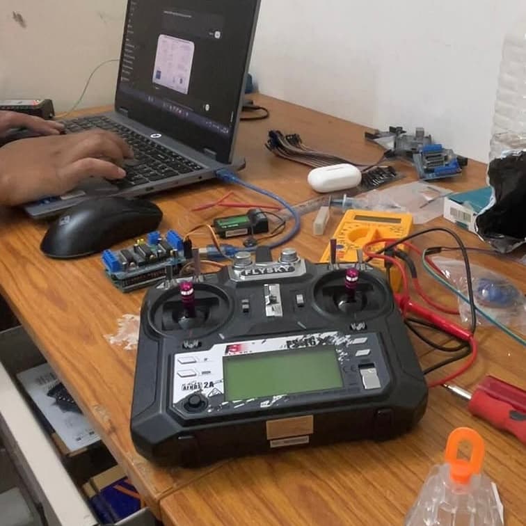 The robotic fish part-assembled on the bench during the build.